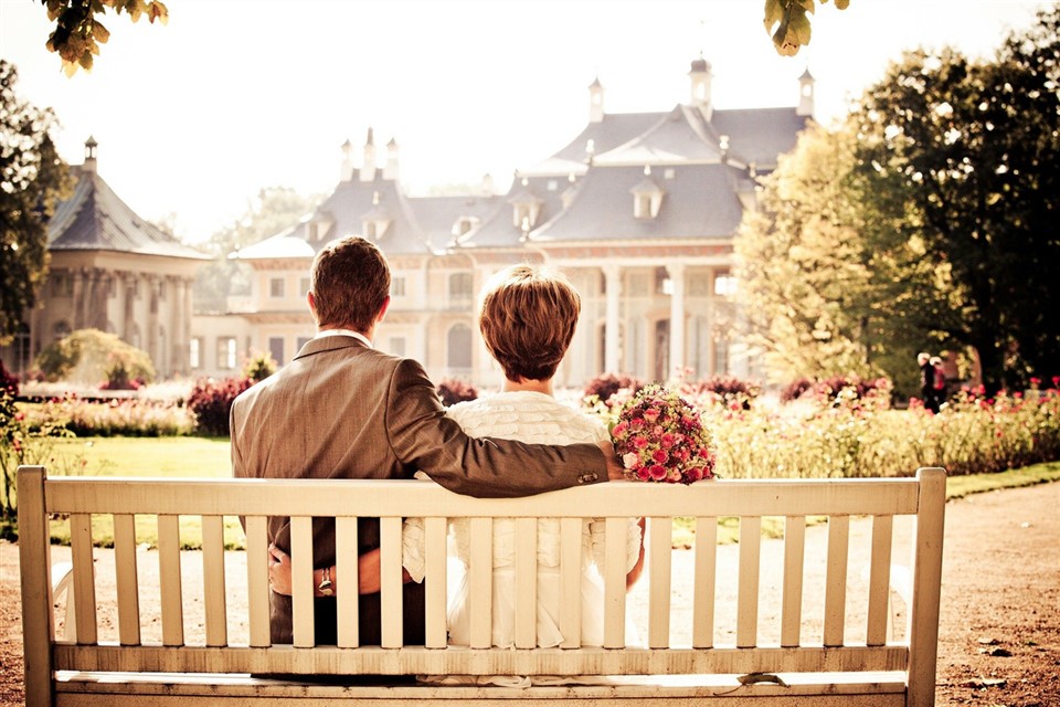 Just married couple sitting on bench jigsaw puzzle