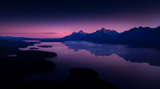 a sunset over a body of water jigsaw puzzle