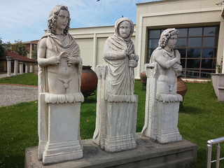 a statue of a man and a woman standing in front of a building jigsaw puzzle