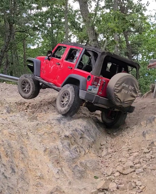 a truck driving down a dirt road jigsaw puzzle