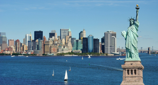 a large body of water with a city in the background jigsaw puzzle