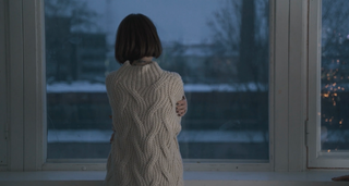 a person standing in front of a window jigsaw puzzle