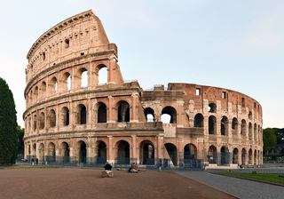 a large stone building with Colosseum in the background jigsaw puzzle