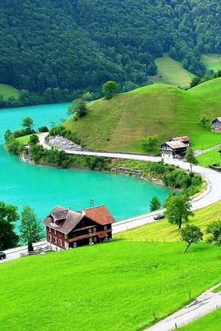 a river with a lush green hillside jigsaw puzzle