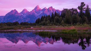 a body of water with a mountain in the background jigsaw puzzle