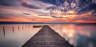 a sunset over a body of water jigsaw puzzle