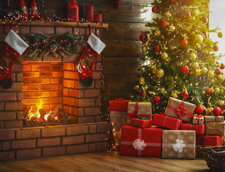 a christmas tree in a living room filled with furniture and a fire place jigsaw puzzle