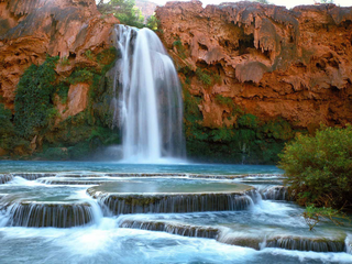 a large waterfall over some water jigsaw puzzle