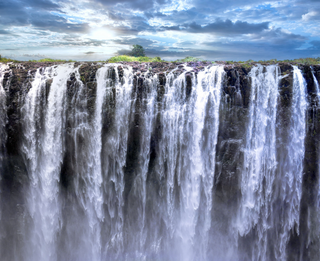 a large waterfall over some water with Victoria Falls in the background jigsaw puzzle