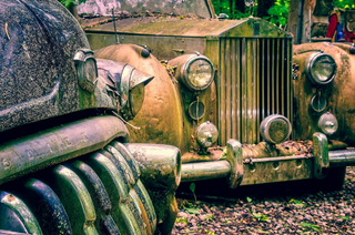 a truck that is sitting on a bench in a park jigsaw puzzle