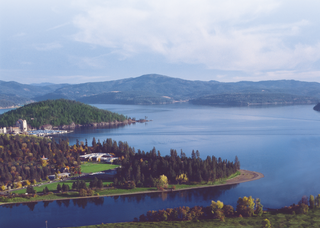 a view of a large body of water with a mountain in the background jigsaw puzzle