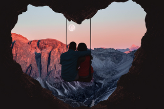 a person standing in front of a mountain jigsaw puzzle