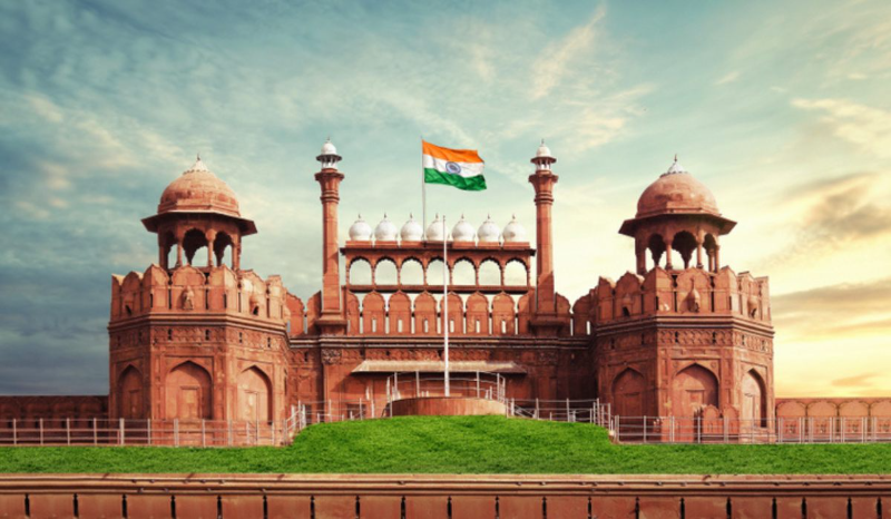 a clock tower in front of Red Fort jigsaw puzzle