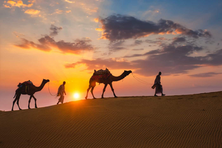 a group of people riding a horse in front of a sunset jigsaw puzzle