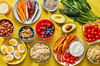 a bowl filled with different types of food on a table jigsaw puzzle