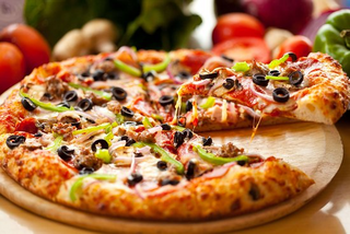 a plate of food with a slice of pizza jigsaw puzzle