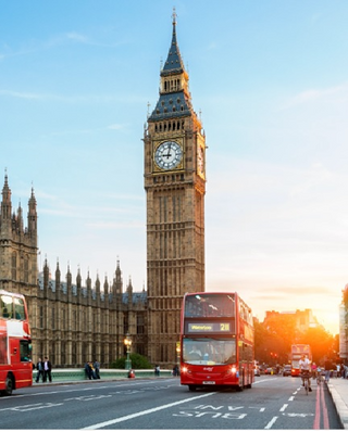 a double decker bus driving down a street with Big Ben in the background jigsaw puzzle