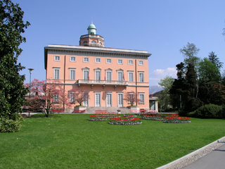 a large brick building with green grass jigsaw puzzle