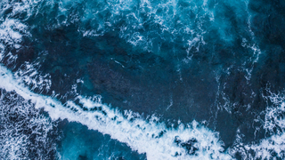 a man riding a wave on a surfboard in the water jigsaw puzzle