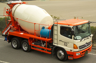 a large orange truck in a machine jigsaw puzzle