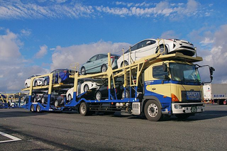 a blue bus parked on the side of a road jigsaw puzzle