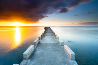 a sunset over a body of water jigsaw puzzle
