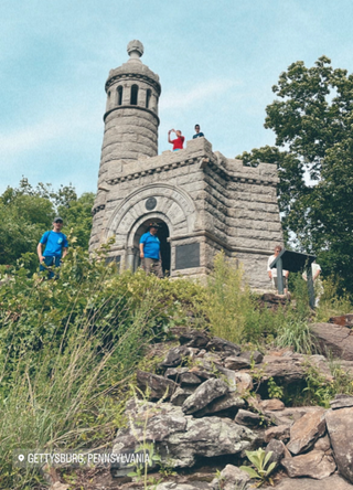 a group of people standing in front of a stone building jigsaw puzzle