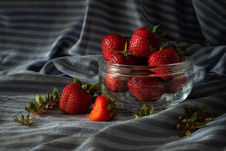 a plate of fruit sitting on top of a bed jigsaw puzzle