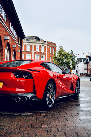 a car parked in front of a brick building jigsaw puzzle
