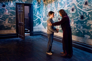 a young boy standing in a room jigsaw puzzle