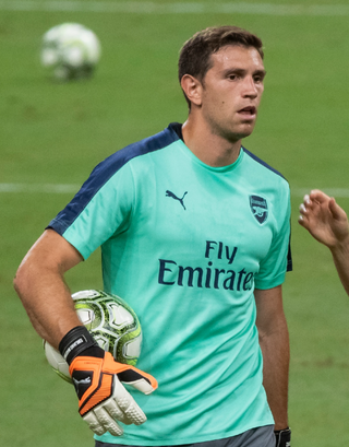 Emiliano Martinez holding a football ball jigsaw puzzle