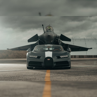 a fighter jet sitting on top of a runway jigsaw puzzle