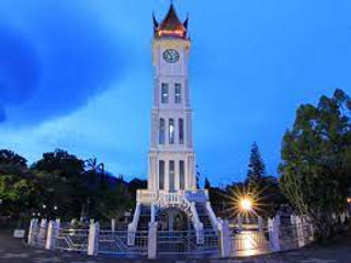 a large tall tower with a clock on the side of a building jigsaw puzzle