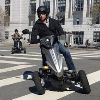 a man riding a motorcycle on a city street jigsaw puzzle