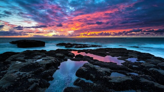 a sunset over a body of water jigsaw puzzle