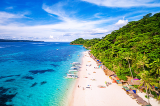 a sandy beach next to a body of water jigsaw puzzle
