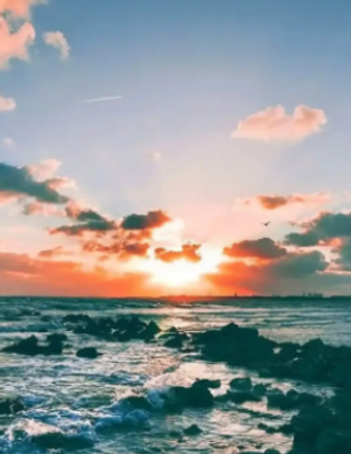 a sunset over a body of water jigsaw puzzle