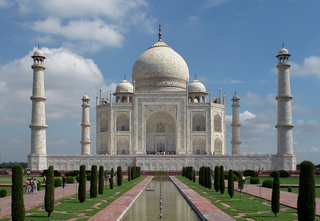 a group of people standing in front of Taj Mahal jigsaw puzzle