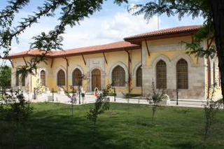 a large brick building with grass and trees jigsaw puzzle