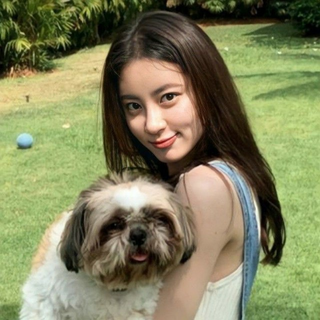 a woman holding a dog posing for the camera jigsaw puzzle