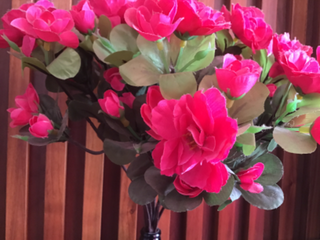 a vase filled with pink flowers on a table jigsaw puzzle