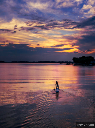 a sunset over a body of water jigsaw puzzle