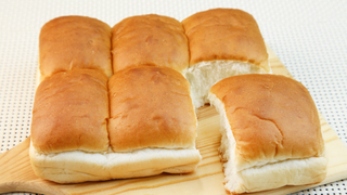 a sandwich sitting on top of a wooden table jigsaw puzzle